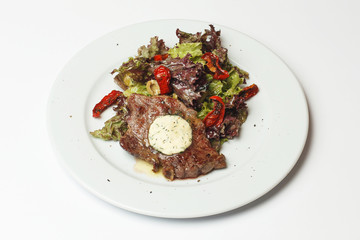 rib eye with baked vegetables and sauce