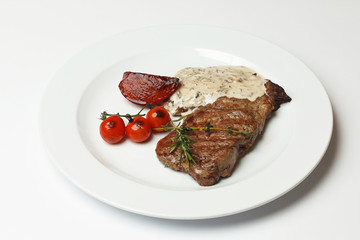 rib eye with baked vegetables and sauce