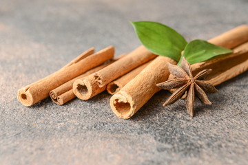 Aromatic cinnamon sticks on grey background