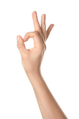 Female hand showing OK gesture on white background