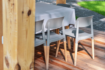 Close up of wooden chairs in outdoor terrace