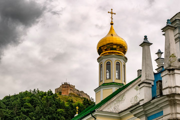 Fototapeta na wymiar St. Nicolas Orthodox Church and Kremenets castle on Mount Bona over town Kremenets, Ternopil region, Ukraine. August 2019