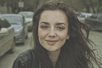 Obraz premium Smiley face of the girl in cinema look style