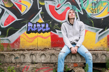 Fototapeta na wymiar a young man in a hoodie hip-hop