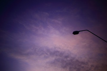 light pole silhouette and blue purple sky sunset sky. rust Colour cloud background. industrial scene concept.