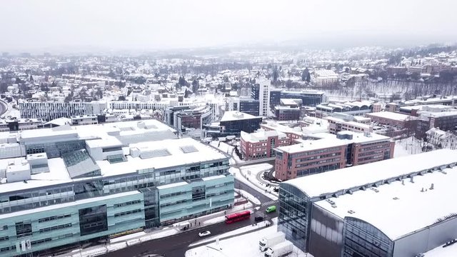 Aerial footage of Oslo, snowy city in a winter day