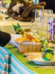 Waiter decorate and setting luxury party dinner table in restaurant.