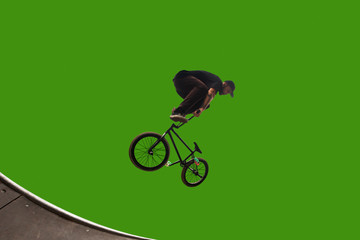 BMX rider on green screen.