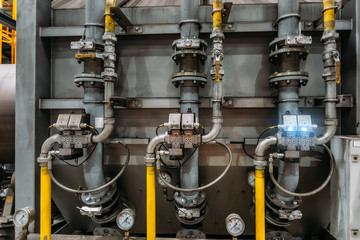 Industrial machinery part, steel pipeline with valves and manometers