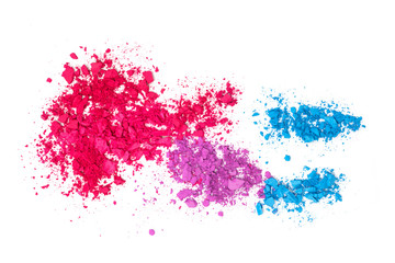 Broken and cracked multi-colored eye shadows on a white background.