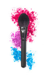 Professional makeup brush and eye shadow pattern on a white isolated background.  View from above.