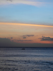 A traditional small fishing boat sailing in the ocean