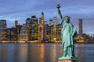 The Statue of Liberty over the Scene of New york Cityscape with Brooklyn Bridge beside the east...