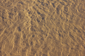 Yellow sand surface.