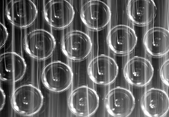 Abstract black and white Background with out of focus glass Rings on Bottles, texture