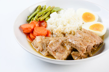 Baked pork ribs with rice, boiled egg and vegetable