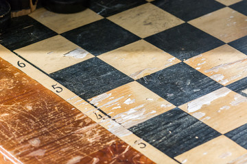 Shiny сhess board in sunlight for playing chess.