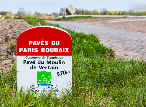 Templeuve,France- April 5, 2014:Image of a specific milestone indicating the start of a cobblestone road included in the route of Paris Roubaix cycling race. 