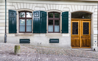 vintage european style building facade with door and windows in Zurich, Switzerland