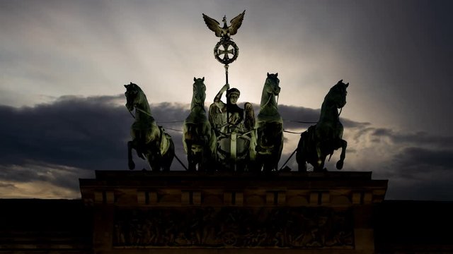 The Quadriga of Apollos Carriage on Brandenburg Gate at Sunrise, Berlin, Germany