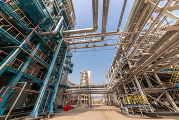 low angle view of metal pipes of industrial plant outdoor 