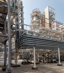 low angle view of metal pipes of industrial plant outdoor 
