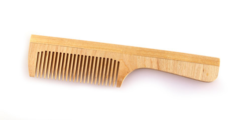 the wooden comb for hair on a white background