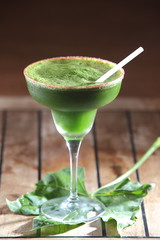 Chaya or tree spinach cocktail with pepper decorated with leaves.