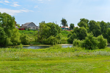 Landscape with a river in the countryside. Summertime