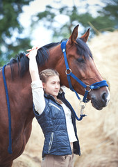 Obraz premium My Best friend. Young teenage girl hugs her favorite horse