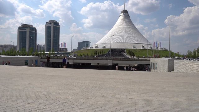  Nur-Sultan Astana Royal Marquee Khan Shatyr Entertainment Center with Walking People and Driving Cars on a Sunny Cloudy Blue Sky Day