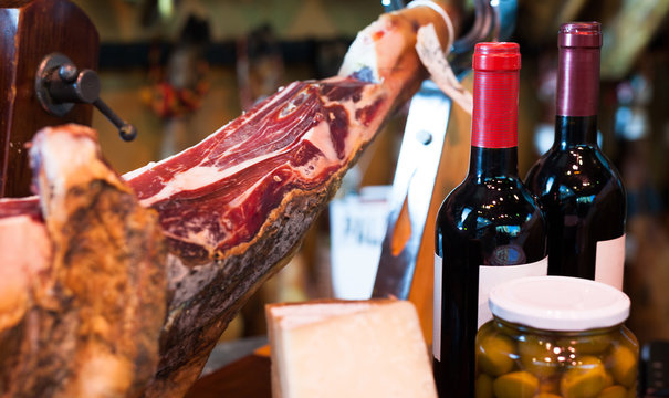 jerked iberic jammon of bacon with wine, cheese and olives