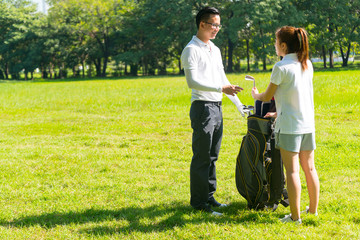 Trainer golf tutor practice for new golf player.