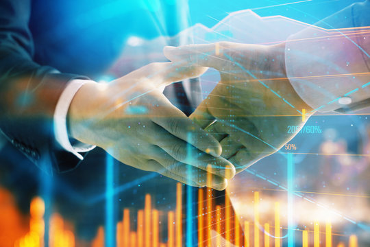 Double exposure of financial chart on cityscape background with two businessmen handshake. Concept of financial analysis and investment opportunities