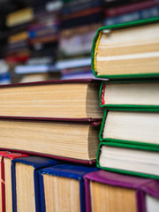Old books lined up on a shelf. Books sold in the book market