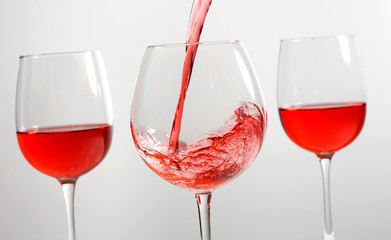 Beautiful splash of red wine in a glass