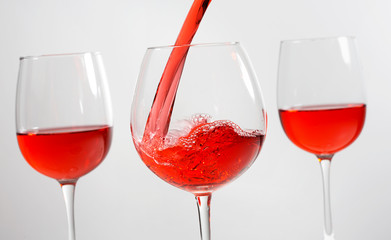 Beautiful splash of red wine in a glass