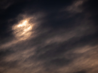 Obraz premium Rising Sun behind The Streaming Clouds