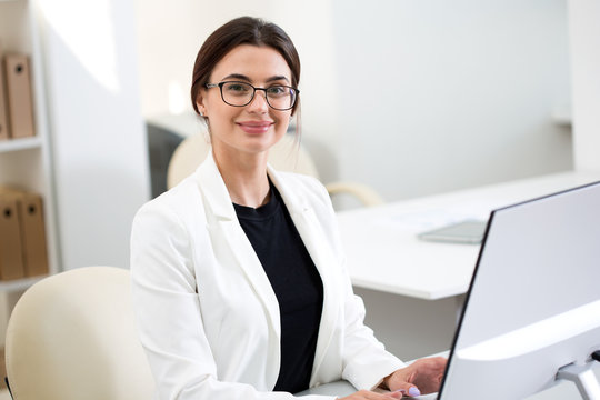 Young beautiful businesswoman with computer