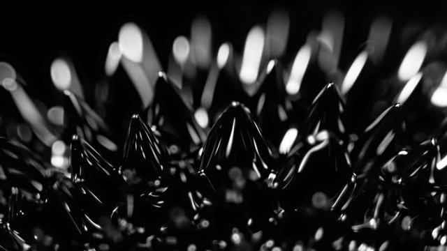 Super Slow Motion Macro Shot of Magnetic Liquid Ferrofluid in Motion at 1000fps. Shooted with High Speed Cinema Camera at 4K.