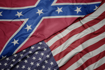 waving colorful flag of united states of america and confederate flag