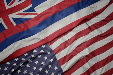 waving colorful flag of united states of america and flag of hawaii state.
