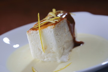 Lemon pie dessert with cajeta and lemon zest sauce.
