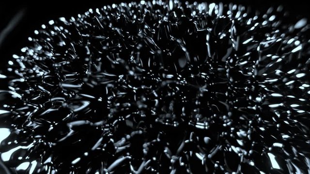 Super Slow Motion Macro Shot of Magnetic Liquid Ferrofluid in Motion at 1000fps. Shooted with High Speed Cinema Camera at 4K.