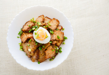 Bowl of rice topped with Braised pork belly and boiled egg, Japanese called Kakuni-don
