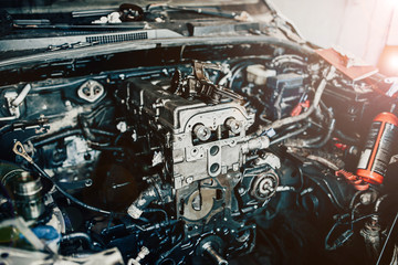 Fototapeta na wymiar repair of an internal combustion engine of a car. Details of the motor.