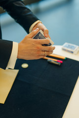 magicians man playing cards in focus