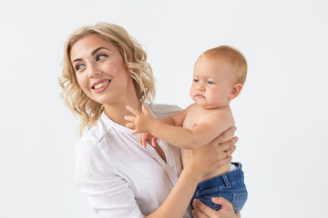Happy mother with adorable baby on white background