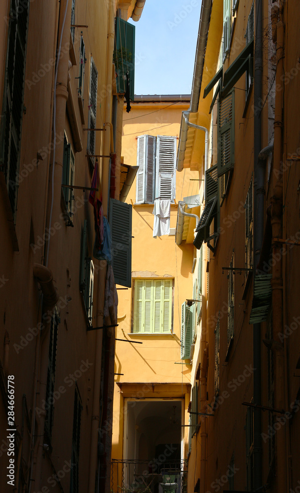 Wall mural menton, old town narrow street, french riviera