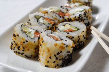 Sushi is traditionally made with medium-grain white rice. It is very often prepared with seafood, such as squid, eel, yellowtail, salmon, tuna or imitation crab meat.